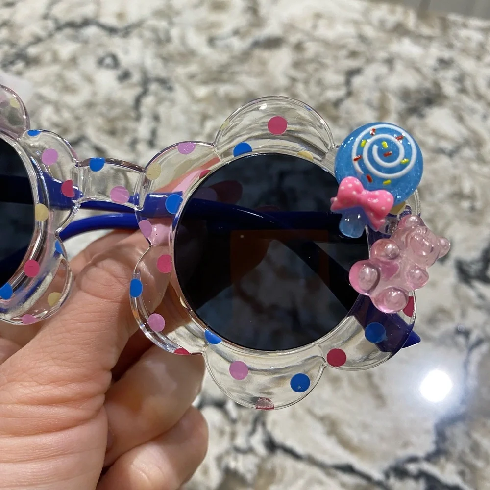 Girls flower shaped blue multi colored dot sunglasses
